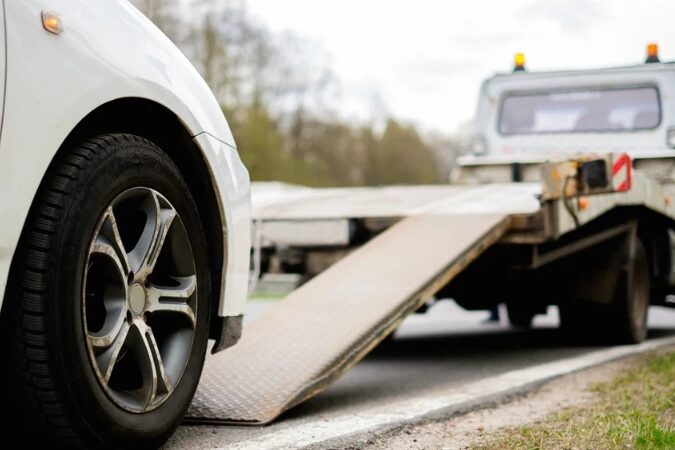 Scrap car being collected in Birmingham for recycling with free same-day removal service